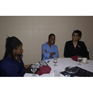 Three Sigma Gamma Rho sisters at the Student Activities Banquet