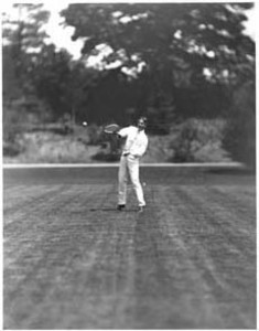 Tennis player, possibly Edward L. Hall, in motion