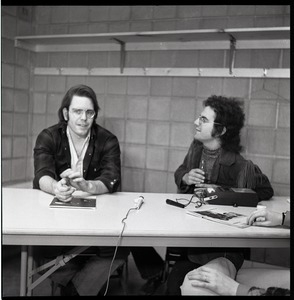 Bob Weir sitting at table with Mitch Sieser (l. to r.)