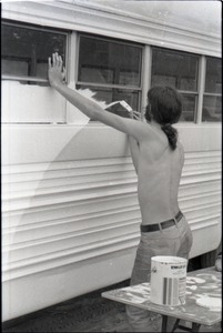 BIll Grabin, shirtless, painting Free Spirit Press bus