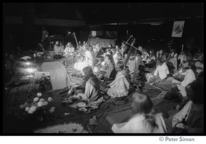 Bhagavan Das onstage in the Winterland Ballroom during the Ram Dass 'marathon,' with Amazing Grace (view from the side of the stage)