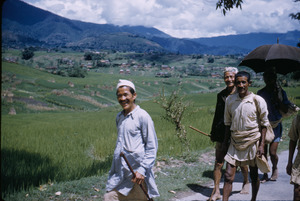 Men walking on road in Kathmandu Valley