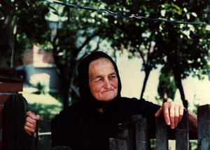 Village woman at fence