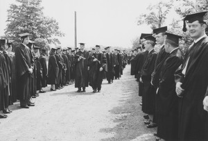 J. Edgar Parks and unidentified man lead a commencement procession