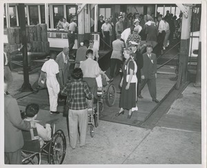 Wheelchair users boarding boat