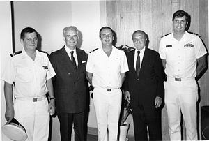United States Navy Lieutenant Commander Pete Churuns with two foreign naval officers and two other unidentified men