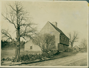 Exterior view of side and front facades of the Boardman House with stone wall and dirt road, Saugus, Mass., undated