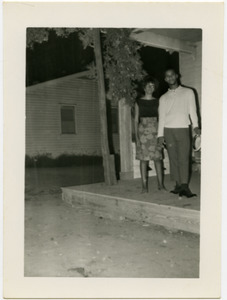 Unidentified civil rights workers standing in front of Rust Avenue house rented by the Congress of Federated Organizations (COFO)