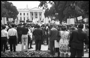 Civil rights protesters with signs demanding fair housing gathered at a demonstration in front of the White House
