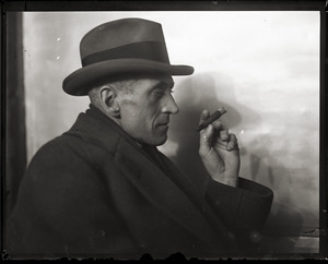 Raymond E. Hanson: portrait with fedora and cigar