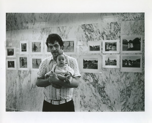 Father minding child at Alice Austen photography exhibit
