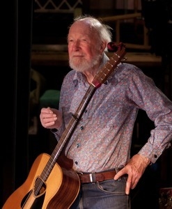 Pete Seeger: portrait with his guitar at the Earth Day concert