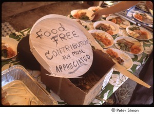 MUSE concert and rally: sign on a table with food reading, 'food free, contributions for MUSE appreciated'