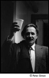 Unidentified man backstage at Saturday Night Live, holding a cup