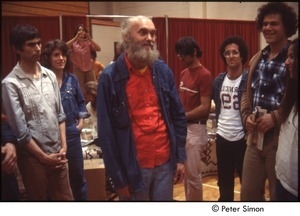 Ram Dass speaking with a group after a lecture at Boston University