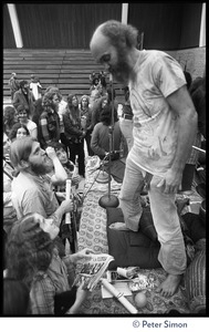 Audience members at the College of Marin gathered in front of the stage to speak to Ram Dass