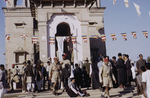 Police and prayer flags at the Mulagandhakuti vihara