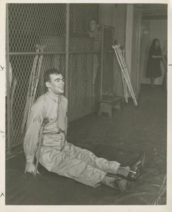 Veteran Arthur Fossa seated on a mat