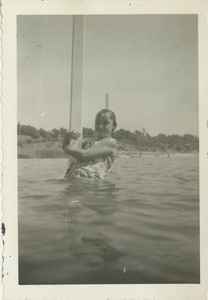 Sharon Kahn holding a pole in unidentified body of water