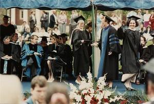 College President Alice F. Emerson Grants Students a Diploma.