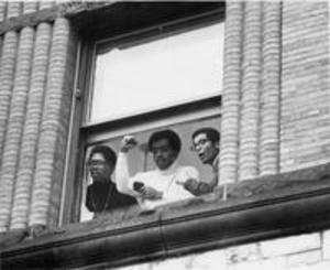 Students at the window of Hopkins Hall during the occupation, 1969
