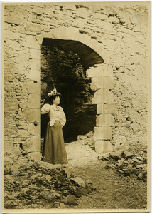 Anna McQueston Johnson standing amidst the ruins of Logie House in Scotland