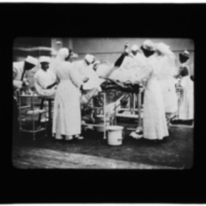 Nurses and doctors in action in the operating room