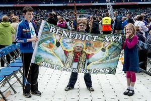Children holding a large flag with a picture of Pope Benedict XV on it, at the 2012 50th Eucharistic Congress, Final Day Ceremony, 17th June, at Croke Park GAA Stadium, Dublin
