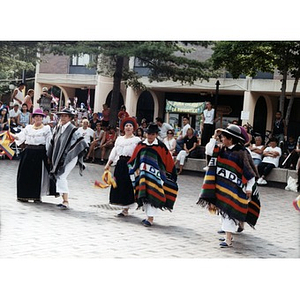 Dancers in folk costume in the plaza at Festival Betances.