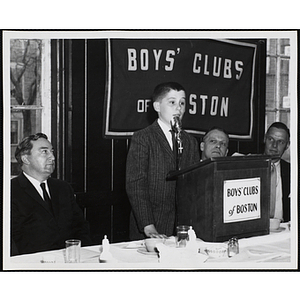 A boy speaking at the podium during a Boys' Clubs of Boston awards event