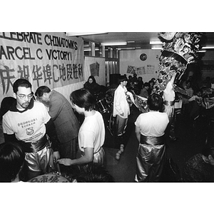 Dancers prepare to perform the Dragon Dance at a dinner held at the Josiah Quincy School marking Chinatown's victory to build a community center on Parcel C