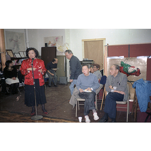 Suzanne Lee addresses a group gathered at the Chinese Progressive Association office for a celebration of the Chinese New Year