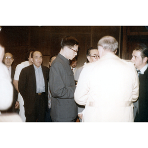 You King Yee waits in line to meet the Chinese Ambassador Chai Zemin during a reception in Boston