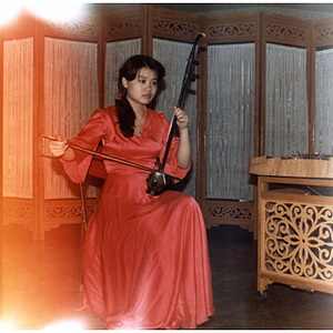 Musician playing an erhu