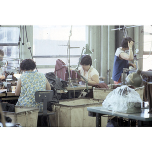 Garment workers at sewing machines