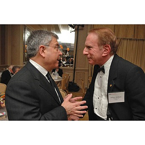 George Chryssis, left, and Robert Shillman conversing at the Huntington Society Dinner