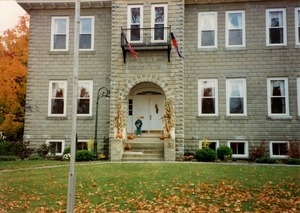 Photograph of the exterior of a former New Salem Academy building around Halloween