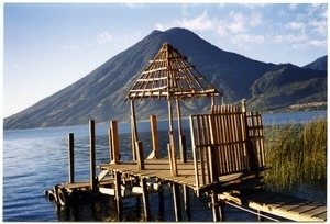 Pier on Lago de Atitlán in San Marcos La Laguna, with volcano in the distance