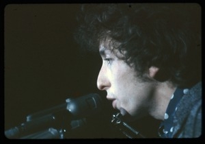 Bob Dylan performing on stage: close-up at the microphone