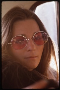 Judy Collins: portrait in rose-colored glasses, seated in the back of car