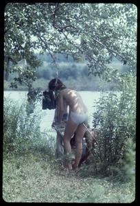 Undressing lakeside during the Woodstock Festival