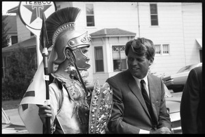 Robert F. Kennedy with a high school student in Trojan costume at the Turkey Day parade