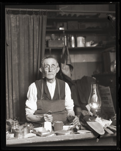 Cobbler in his shop