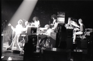 Santana concert at the Springfield Civic Center: view of band from behind bank of audio equipment