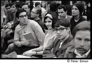 Young couple in crowd awaiting speech by presidential candidate Eugene McCarthy at Boston University