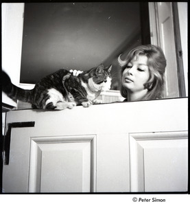 Joanna Simon petting a cat
