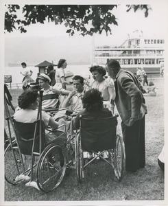 Wheelchair users talking outside