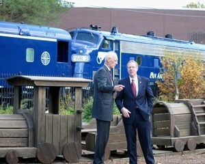 Congressman John W. Olver by a Pan Am Railways train
