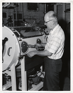 An unidentified man with an iron lung