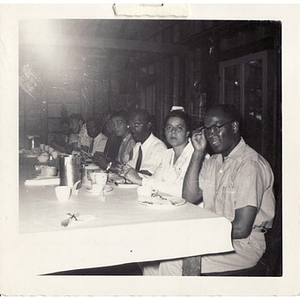 Breezy Meadows Camp staff members, seated at a table in the dining hall
